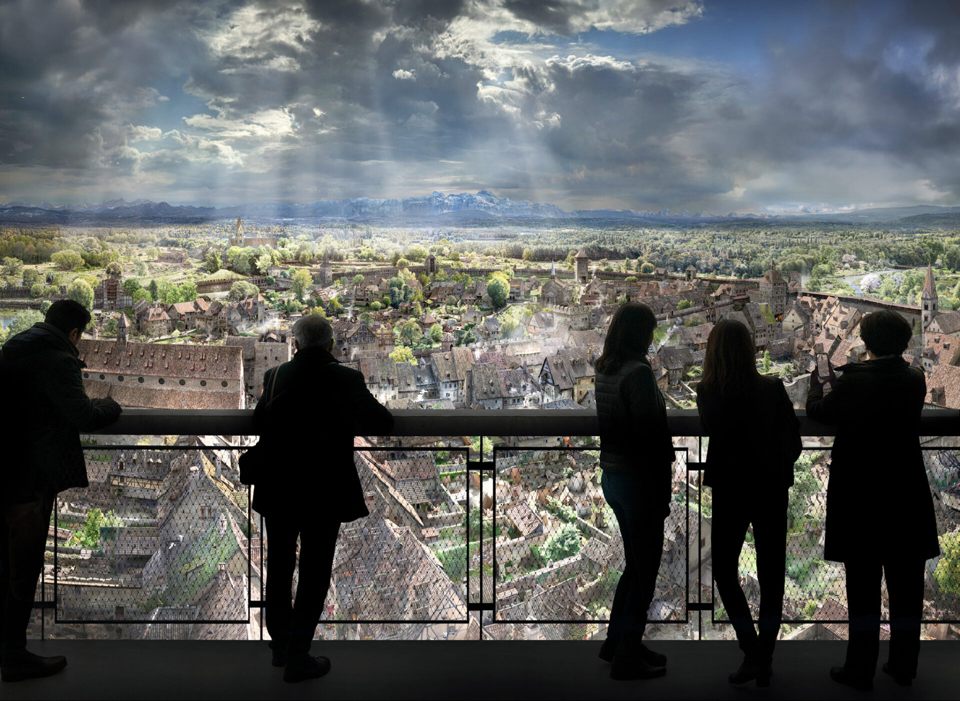 Visitors look over a panoramic view of medieval Konstanz and the Alps from the panorama platform.
